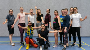 Group of people at a sport hall.