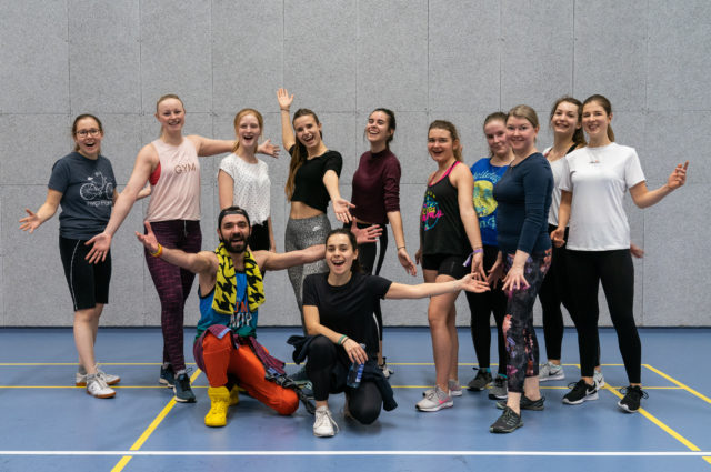 Group of people at a sport hall.