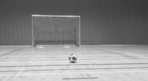 black and white photo of futsal goal and futsal ball